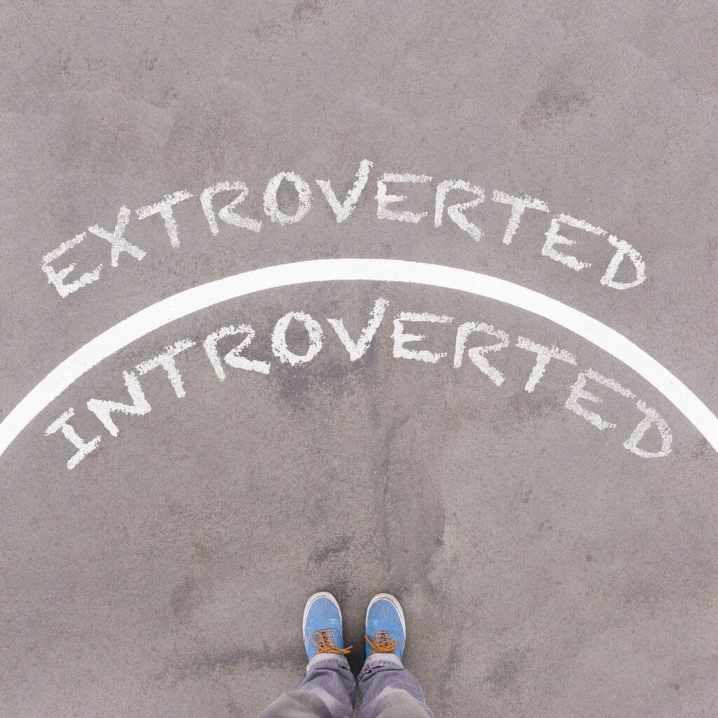 networking nirvana for introverts: thriving in your own way | extroverted vs introverted text on asphalt ground
